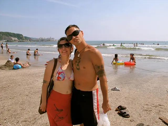 Korean sea women, known as Haenyeo, raise the national flag Taegukgi above Dokdo in celebration of...