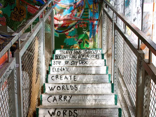 In this image we can see a staircase with some text on it and metal railings on both sides. In the...