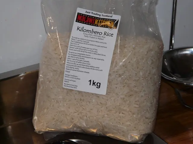 In the image there is a packet with rice grains. On the packet there is a sticker with some text....