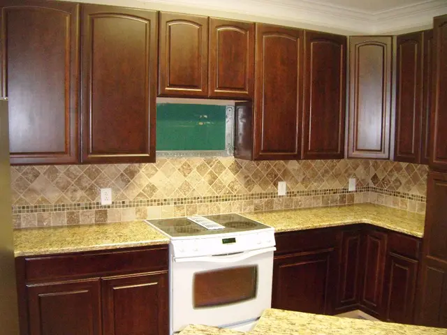 This is an inside view of a room. At the bottom there are few table cabinets and also there is a...