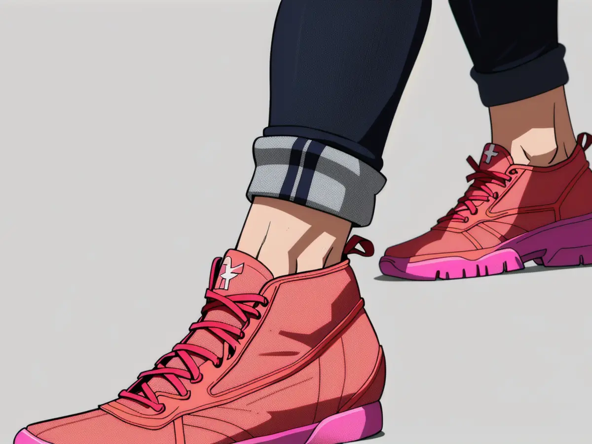 Model sporting pink sneakers in photos/images/footage. Individual sporting pink sneakers in fashionable display.